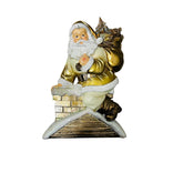Figura decorativa de Papa Noel de 31 cm bajando por una chimenea con saco de regalos dorado